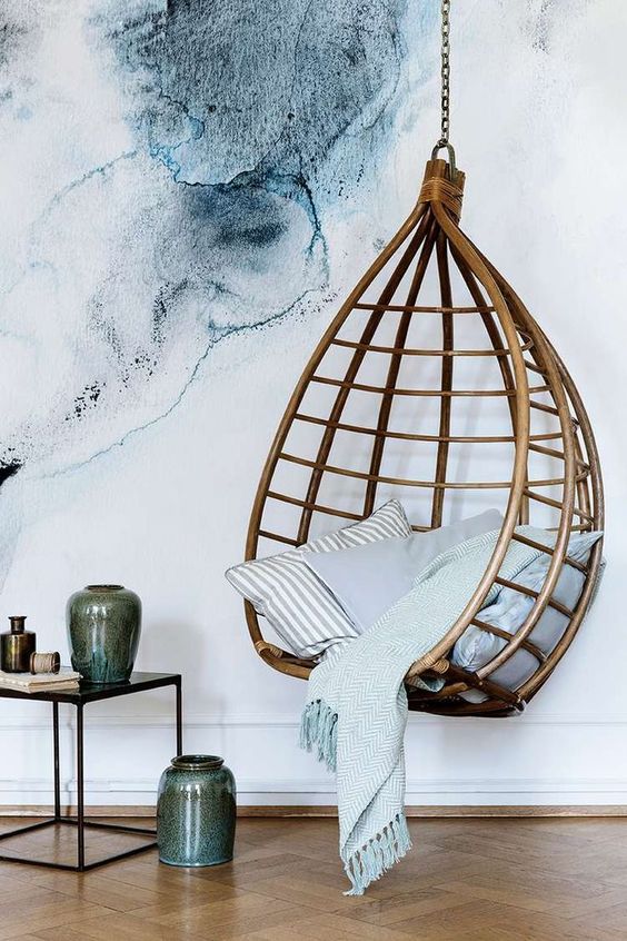 Large scale water color - ink blue artwork design and hanging basket. Incredible styling with pottery and mixed linens